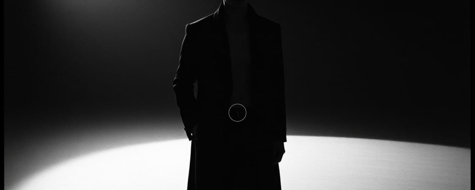 Backlit silhouette of a figure in a long dark coat standing in a spotlight, from the film section of the BAGGATTI PARIS homepage design